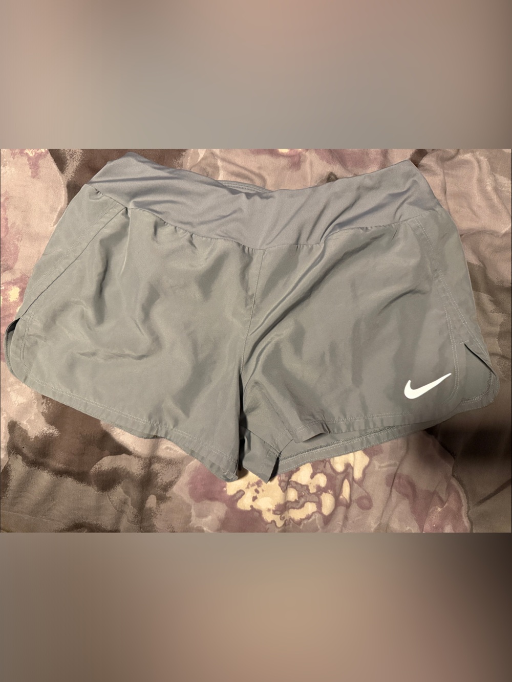 Nike Women’s Light Gray Athletic Shorts with Silver Swoosh